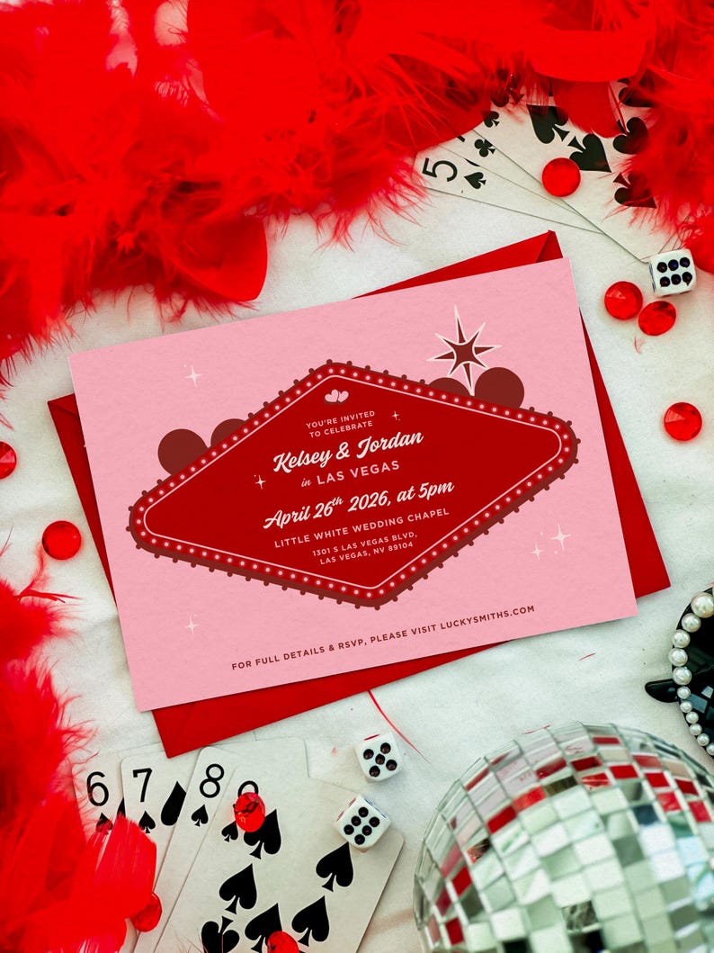 May include: A pink wedding invitation with a red border and a Las Vegas theme. The invitation includes the names Kelsey & Jordan, the date April 26th, 2026, and the location. The image also includes playing cards, dice, and a disco ball.
