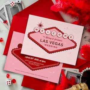 May include: Pink and red Las Vegas wedding invitations with a retro sign design. The invitations include the text "Welcome to Kelsey & Jordan's Las Vegas Wedding" and event details. Playing cards, dice, and a bottle of champagne are also in the image.