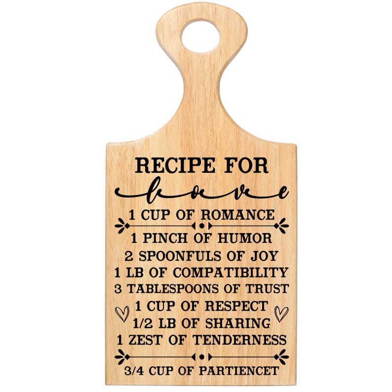 May include: Wooden cutting board with a handle, featuring the text "RECIPE FOR love" in black script. The recipe includes ingredients like romance, humor, joy, and trust, with measurements in cups, pinches, and tablespoons.