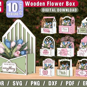May include: A selection of 10 laser-cut wooden flower box designs. The boxes are in various shapes, including an envelope, a house, and a basket. Each box is filled with artificial flowers in shades of pink and blue. The text "MOM MEANS everything" is visible.