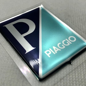 Piaggio Logo 3D Domed Gel Sticker: Silver & Blue Scooter Emblem (50x40mm)