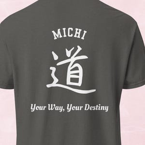 May include: Dark gray t-shirt with the word "MICHI" above a white Japanese symbol and the text "Your Way, Your Destiny" in white. The shirt has a crew neck and short sleeves.