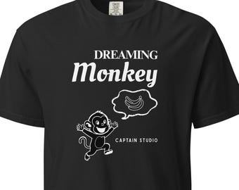 Dreaming Monkey Graphic T-Shirt | Stay Hungry Stay Curious Streetwear Tee for Dreamers & Hustlers | Comfort Colors 1717 | Black