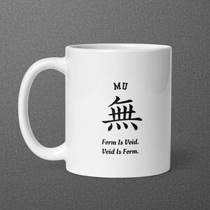 May include: A white ceramic mug featuring the black text MU above a large black Japanese kanji character for nothingness, followed by the black text Form Is Void. Void Is Form. The mug has a curved handle on the left side and a smooth finish.