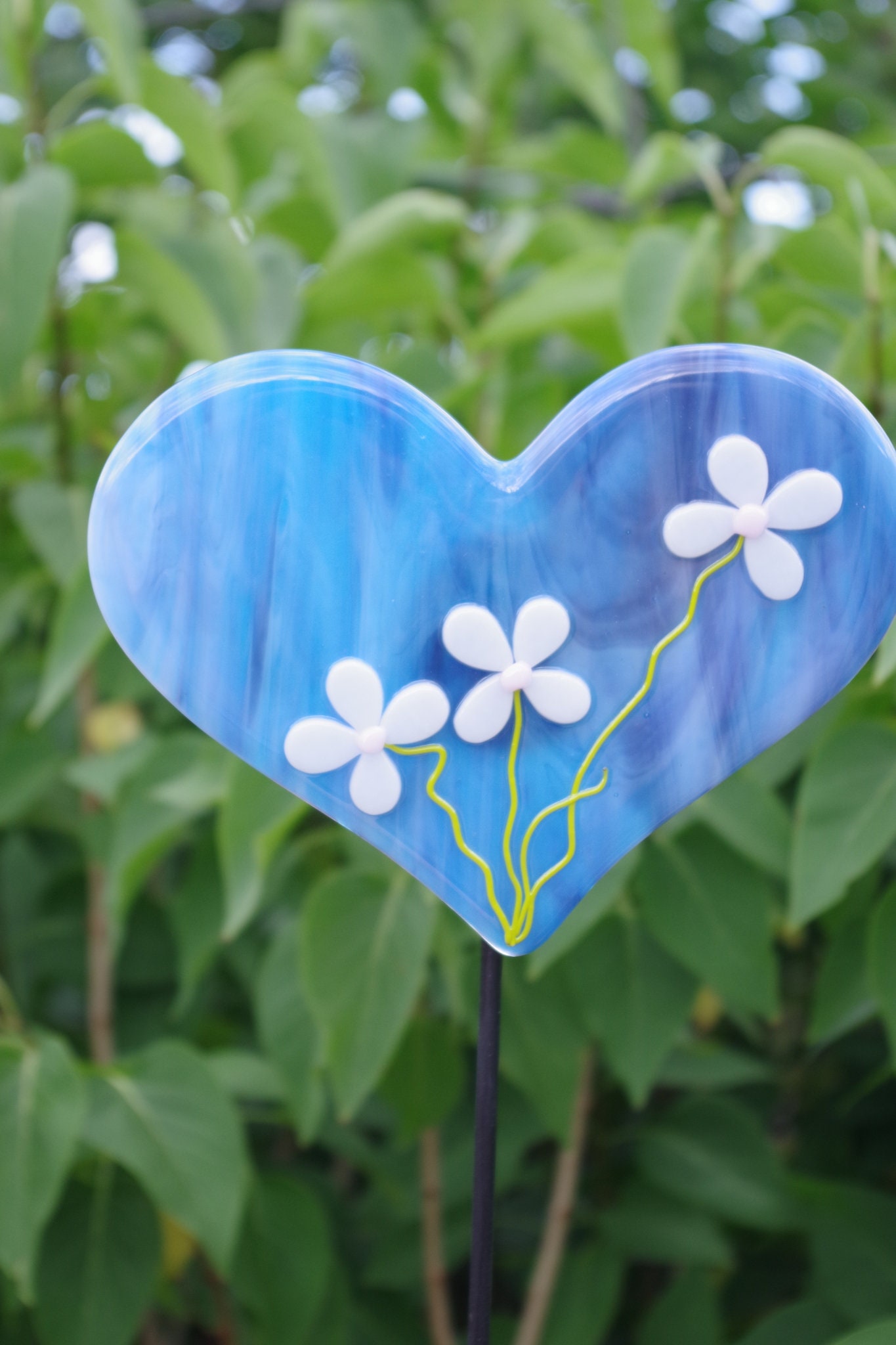 Bright and colorful fused glass heart for your garden