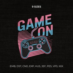 May include: An embroidery design featuring the text GAME ON in pink and blue, with a video game controller graphic below it. The design includes horizontal lines and the text 9 SIZES at the top, with file formats EMB, DST, CND, EXP, HUS, JEF, PES, VP3, XXX.
