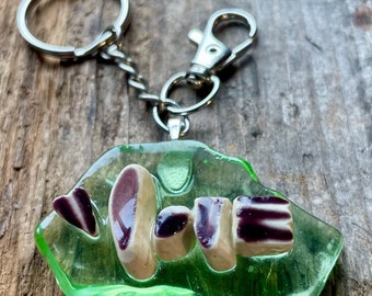 Vintage Purple McCoy Love Heart Bag Charm in Tumbled with Uranium Vaseline Glass. She glows...under UV light!