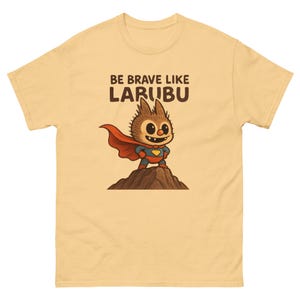 Be Brave Like Larubu T-Shirt | Superhero Cartoon Shirt for Kids & Adults | Cute Labubu Character Tee | Motivational Graphic Shirt