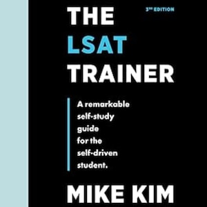 May include: A book cover for "The LSAT Trainer" by Mike Kim. The cover is black with white and light blue text. The title is in large white letters, with "LSAT" in light blue. The text reads "A remarkable self-study guide for the self-driven student."