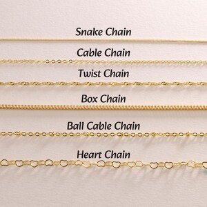 May include: A selection of gold-colored chain necklaces, each with a unique design. The image displays six different chain styles: Snake Chain, Cable Chain, Twist Chain, Box Chain, Ball Cable Chain, and Heart Chain. Text labels identify each chain type.