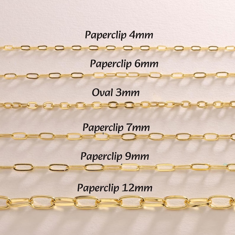 May include: A white ceramic mug with a black handle and the text "But First, Coffee" in a bold, black font. The mug is set against a blurred background, suggesting a cozy setting.