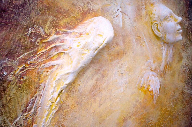 May include: A textured, abstract painting featuring a white, sculpted angel wing and a white, sculpted face against a yellow and brown background.