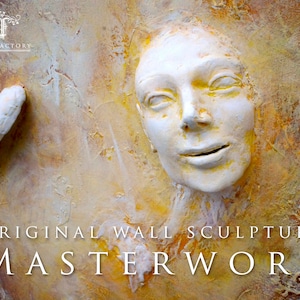 May include: Original wall sculpture artwork featuring a white, textured face with a subtle smile. The background is a warm, yellow and orange colour.