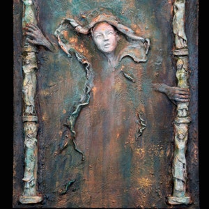 May include: A textured, green, brown, and gold wall sculpture with a central figure of a woman with a flowing white cloth. The sculpture is framed by two columns with figures on them. The text "Wall Sculpture: Bindi Art - by Dr Franky Dolan" is at the bottom of the image.