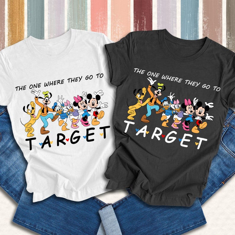 May include: A white t-shirt and a black t-shirt, each featuring a graphic of Pluto, Goofy, Donald Duck, Daisy Duck, Minnie Mouse, and Mickey Mouse. The text reads THE ONE WHERE THEY GO TO TARGET, with the word TARGET in a stylized font.