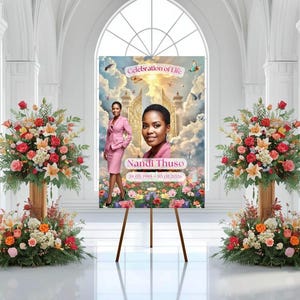 May include: A memorial sign on a wooden easel, featuring a portrait of Nandi Thuso and the text "Celebration of Life." The sign includes images of flowers, butterflies, and a heavenly background. Floral arrangements flank the sign.