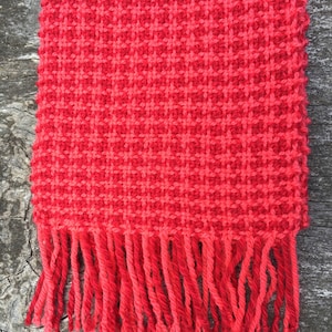 Handwoven wool scarf in red and pink houndstooth check image 1