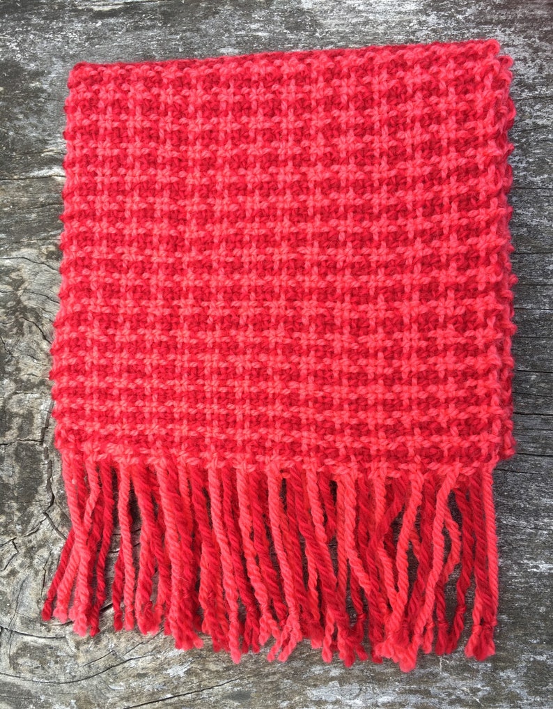 Handwoven wool scarf in red and pink houndstooth check image 1