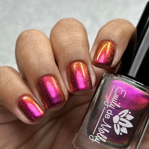 Multichrome nail polish - Vague Memories -  A large particle multichrome that shifts from a dark burgundy pink / orange / gold.