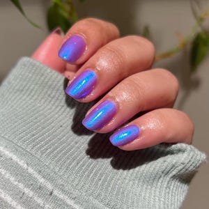 Nail Polish - The Ones Who Live - A beautiful lilac nail polish with a blue aurora shimmer.