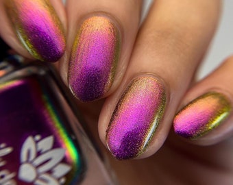 Nail polish - "I Know The Cost" A large particle multichrome that shifts from a purple / red-orange / gold /  golden green.