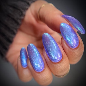 Nail Polish - Check Again - A light purple nail polish with a strong blue to pink shimmer.
