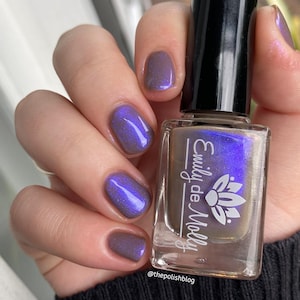 Shimmer nail polish - Written Invitation - A taupe brown nail polish with a blue / purple shimmer.