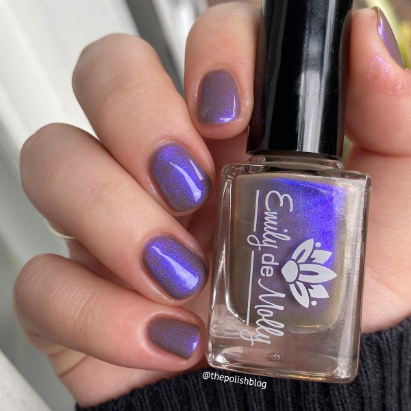 Shimmer nail polish - Written Invitation - A taupe brown nail polish with a blue / purple shimmer.