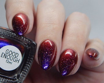 Good Enough - A black to red multichrome nail polish with purple shimmer and silver holo flakes.