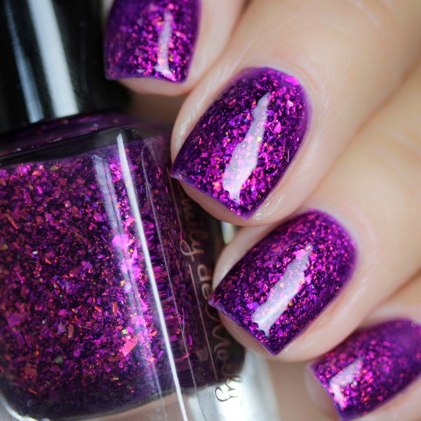 Flakie nail polish - Half Orange - A dark purple nail polish with orange / pink / gold / green iridescent flakes.