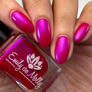 Nail polish Volume Up A pink nail polish with a blue / purple aurora shimmer. image 6