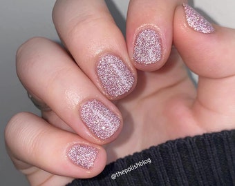 Reflective nail polish - Quiet And Daring - A light dusty pink nail polish with silver reflective glitters.