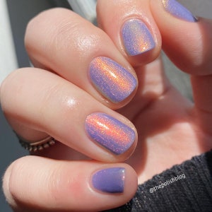 Nail polish - Get In Line - A light purple nail polish with a pink / orange / gold / green shifting aurora shimmer.