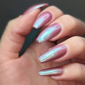 Shimmer nail polish - From What You Know - A salmon pink nail polish with a turquoise shimmer.