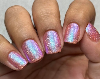 Shimmer nail polish - Kiss In The Wind - A light pink nail polish filled with cyan / blue / purple  shimmer and holo glitters.