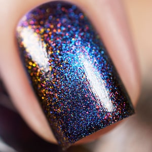 Magnetic nail polish - That Seems Ominous - A black nail polish with aurora shimmer and a blue magnetic effect.