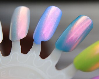 Nail polish - "Pinkie Swear" A clear base with pink to orange to gold shifting fine particle aurora shimmer.