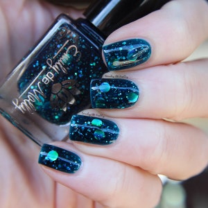 Nail polish - "Oceanic Forces" holographic dot glitter in a dark teal base