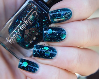 Nail polish - "Oceanic Forces" holographic dot glitter in a dark teal base