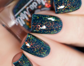 Nail Polish - Rain On My Parade - A navy nail polish filled with orange to green shifting iridescent glitters.