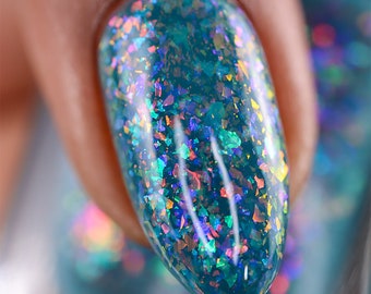 Nail Polish - Judgement Day - A steel blue jelly nail polish with assorted iridescent flakes.