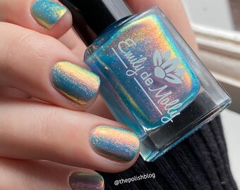 Shimmer nail polish - Cold Tolerance -  A bright blue nail polish with a pink / orange / gold / green shimmer.