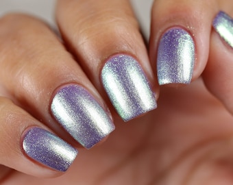 Nail polish - Savvy Trinket - A purple nail polish with a golden green shimmer.