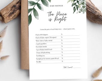 Puede incluir: Una tarjeta de juego para baby shower con el texto "The Price is Right" y una lista de artículos para bebés. La tarjeta es blanca con detalles de hojas verdes y está sobre un sobre marrón.