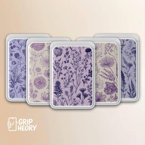 May include: Five phone wallets with floral designs in shades of purple and beige. Each wallet features a different botanical illustration, including flowers and foliage. The wallets have a white border and are arranged in a row.
