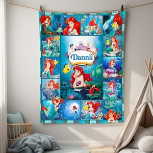May include: A personalized, turquoise blanket featuring a collage of images from the animated film, The Little Mermaid. The blanket showcases Ariel, Flounder, and Sebastian, with the name "Dannii" in a central oval.
