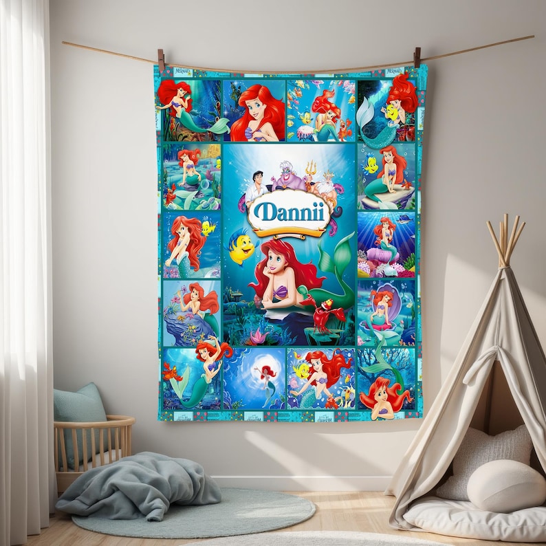 May include: A personalized, turquoise blanket featuring a collage of images from the animated film, The Little Mermaid. The blanket showcases Ariel, Flounder, and Sebastian, with the name "Dannii" in a central oval.