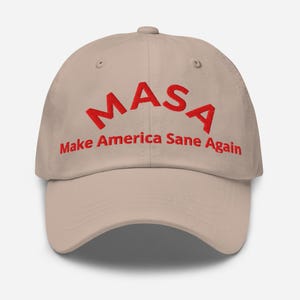 May include: A beige baseball cap with the text "MASA Make America Sane Again" embroidered in red.