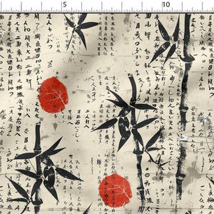 May include: Fabric with a Japanese-inspired design. The cream-colored fabric features black bamboo stalks and leaves, red leaf accents, and handwritten text. The design includes a few silver safety pins.
