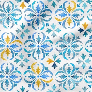 May include: White fabric with a repeating watercolour pattern of blue and yellow floral and geometric shapes. The design features four-petal flowers and smaller, stylized leaf shapes.